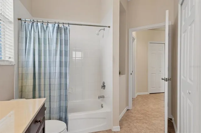 a bathroom with a shower curtain