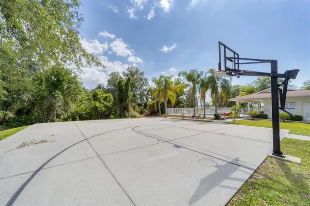 a view of a swimming pool with an outdoor space and seating area