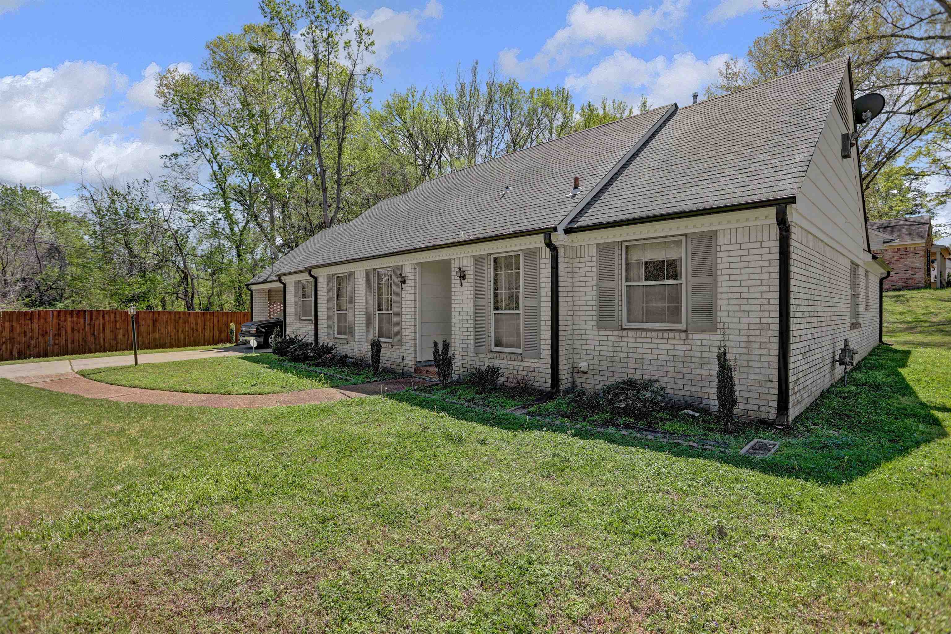 4755 Stage Road Memphis, TN 38128 - Photo 4 of 31 a view of a house with backyard and garden