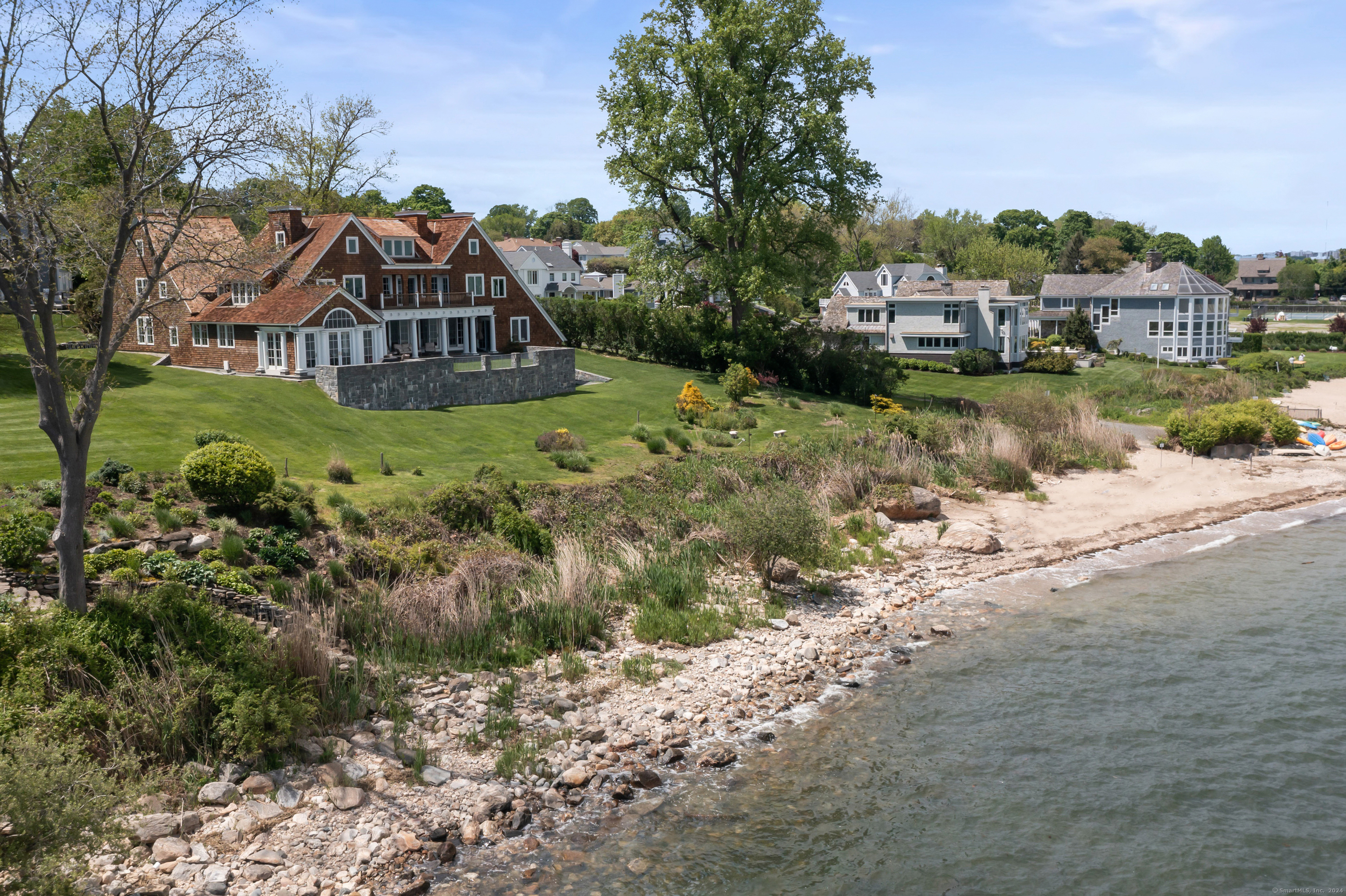 a view of a house with a yard and sitting area