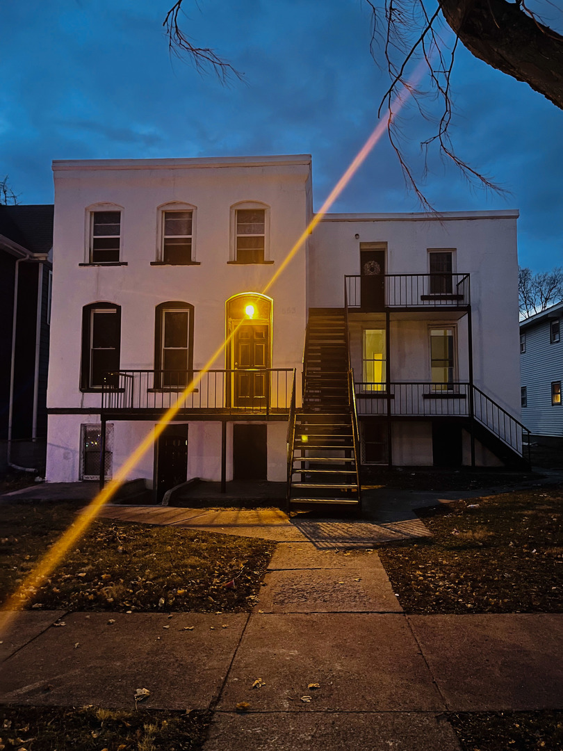 553 South 3rd Avenue Kankakee, IL 60901 - Photo 3 of 14 a front view of a house with a yard