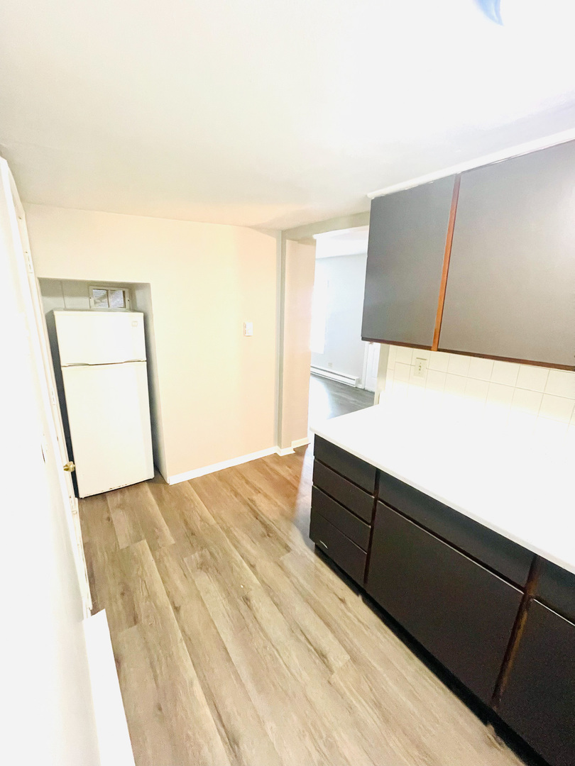 553 South 3rd Avenue Kankakee, IL 60901 - Photo 6 of 14 a bedroom with a bed and a night stand