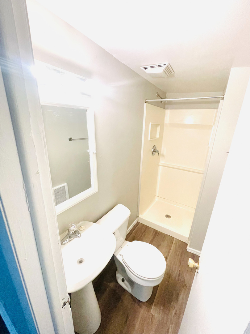 553 South 3rd Avenue Kankakee, IL 60901 - Photo 7 of 14 a bathroom with a granite countertop sink toilet and shower