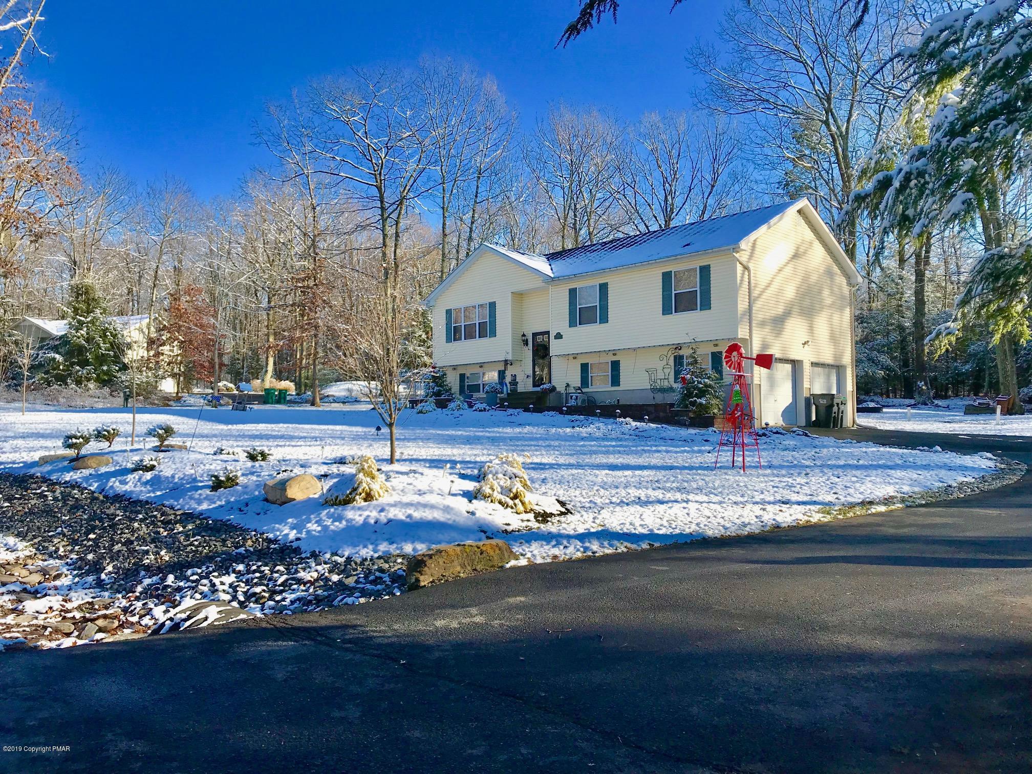 306 Pennbrook Road Stroudsburg, PA 18360 - Photo 1 of 18 a front view of a house with a yard