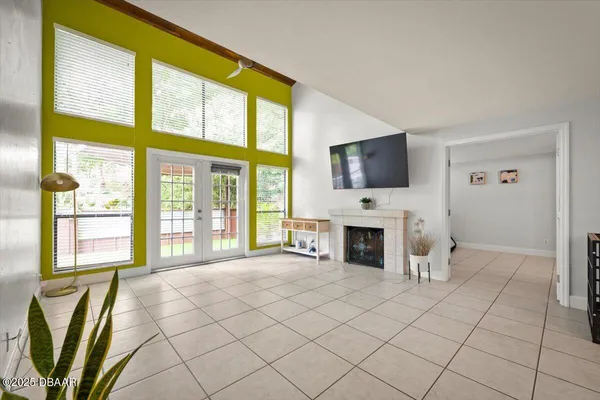 a living room with fireplace furniture and a flat screen tv