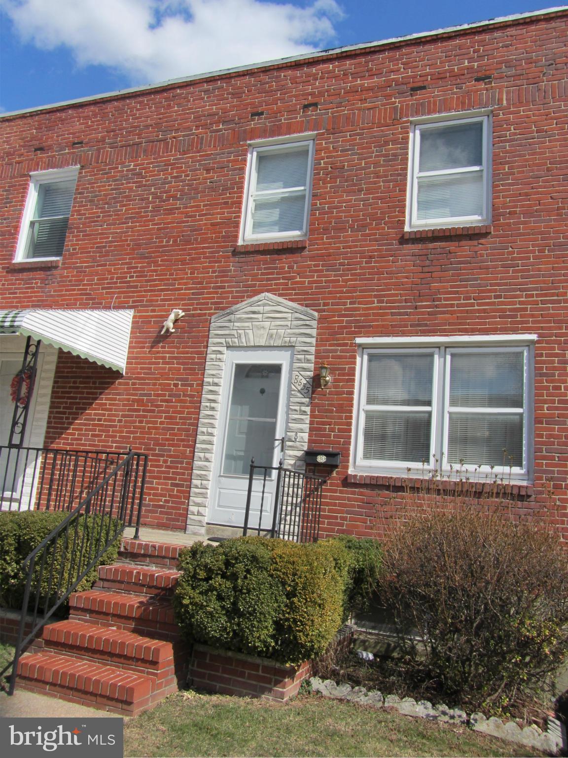 8655 Oak Road Baltimore, MD 21234 - Photo 1 of 27 front view of a brick house with a small yard
