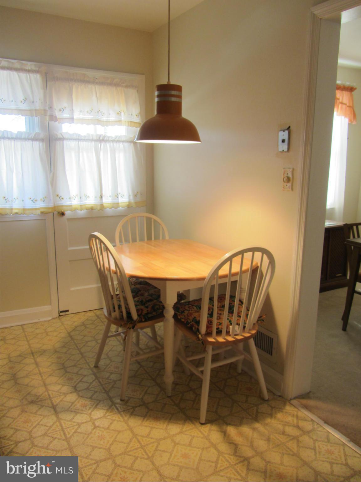 8655 Oak Road Baltimore, MD 21234 - Photo 5 of 27 a dining room with furniture and window