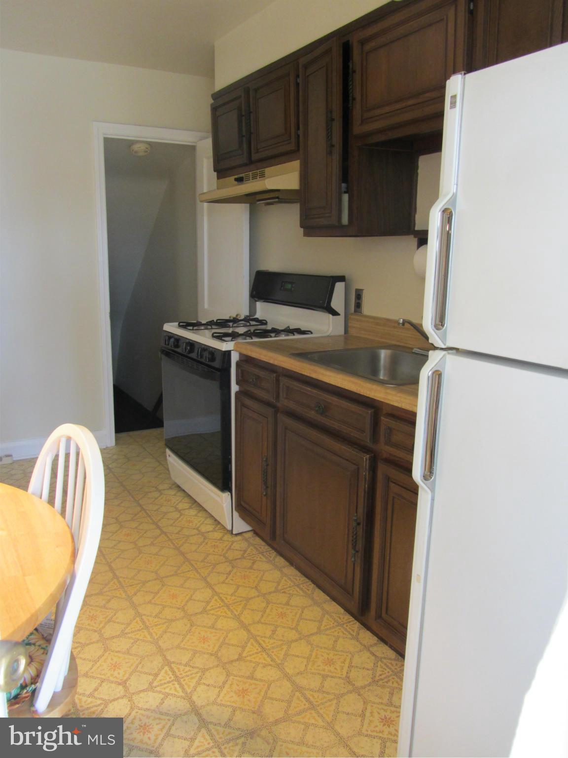 8655 Oak Road Baltimore, MD 21234 - Photo 6 of 27 a utility room with sink dryer and refrigerator