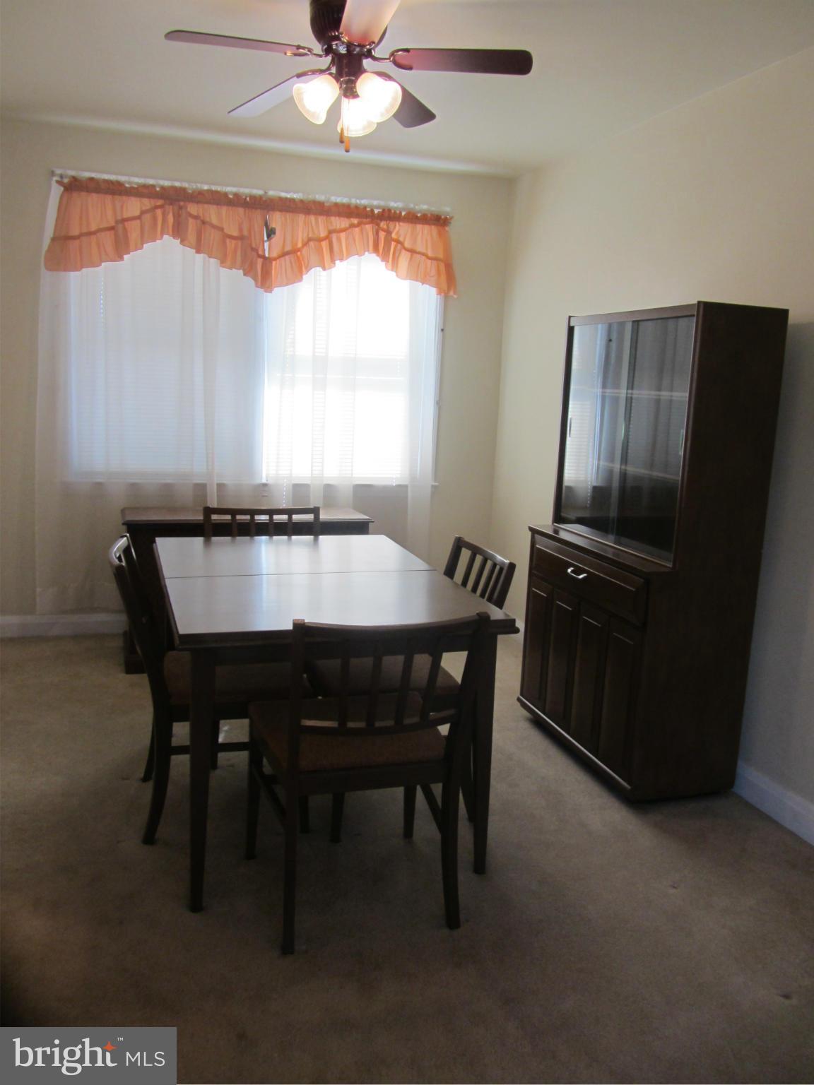 8655 Oak Road Baltimore, MD 21234 - Photo 7 of 27 a dining room with furniture and window