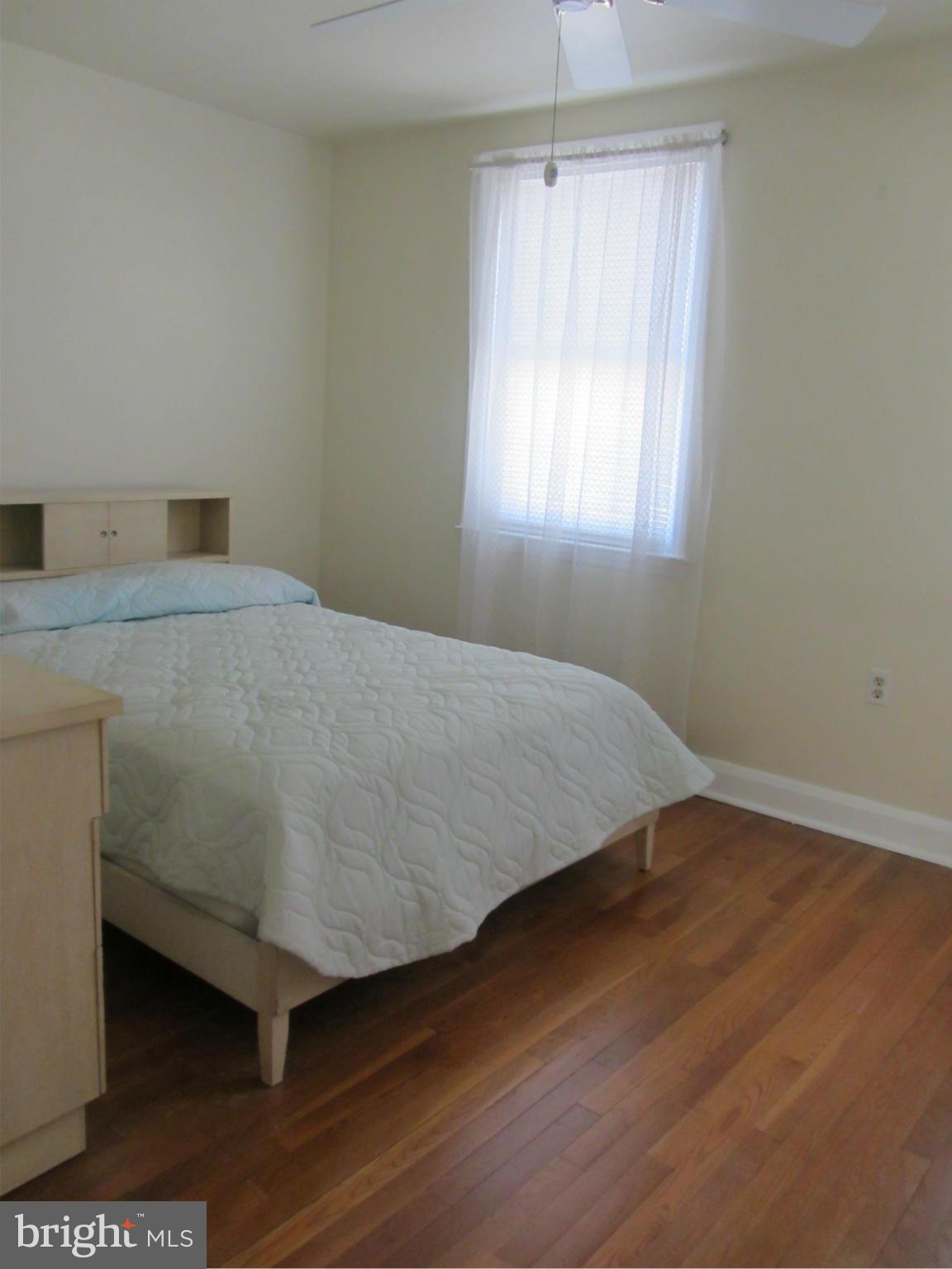 8655 Oak Road Baltimore, MD 21234 - Photo 8 of 27 a bedroom with a bed and a window