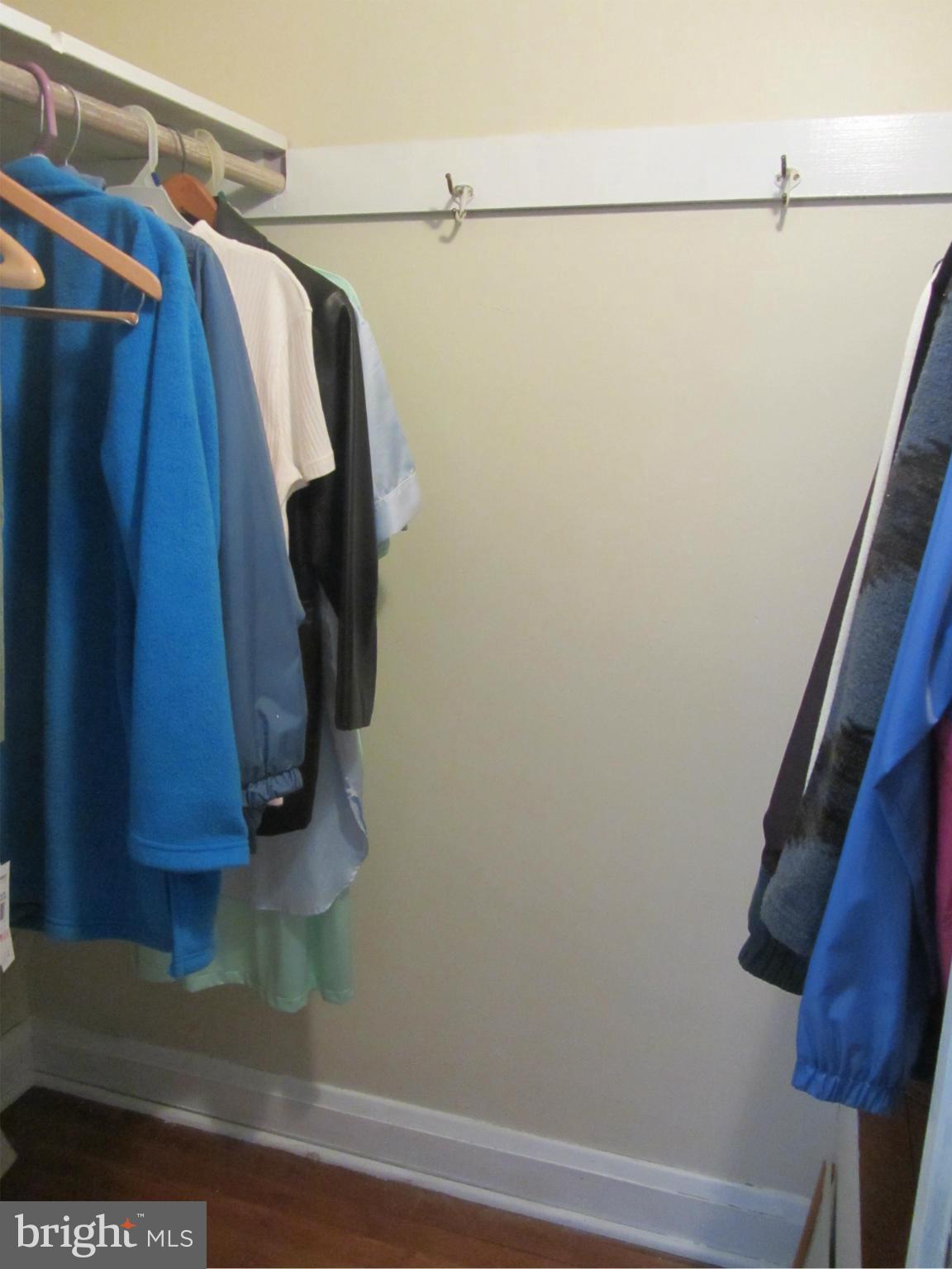 8655 Oak Road Baltimore, MD 21234 - Photo 10 of 27 a view of walk in closet with clothes and shoes