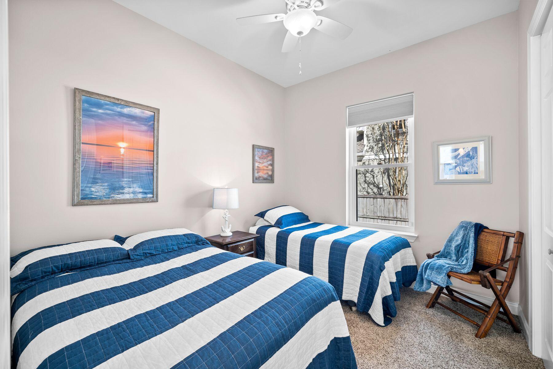 2452 Bay Grove Road Freeport, FL 32439 - Photo 31 of 51 a bedroom with two beds and a window