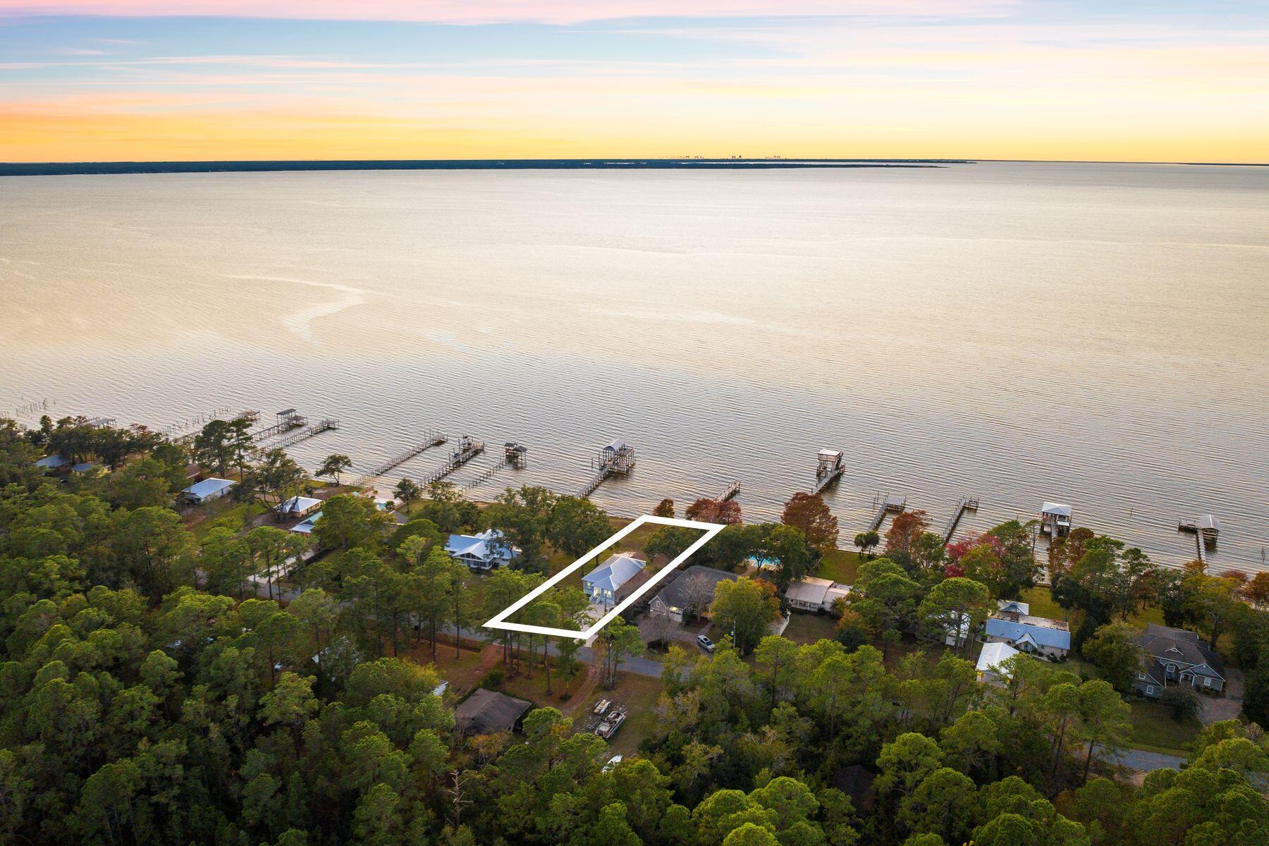 2452 Bay Grove Road Freeport, FL 32439 - Photo 42 of 51 a view of a lake in middle of forest