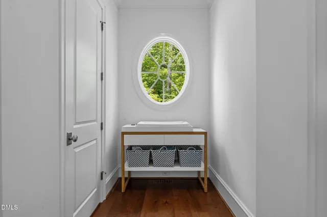 a bedroom with two beds and a window