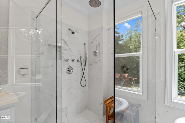 a room with furniture pool table and windows