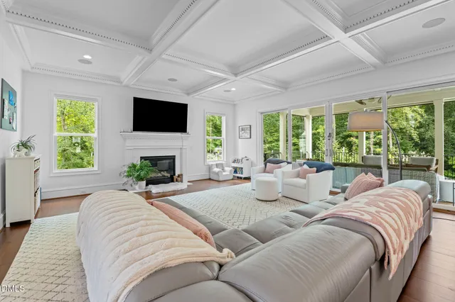 a living room with furniture fireplace and a flat screen tv