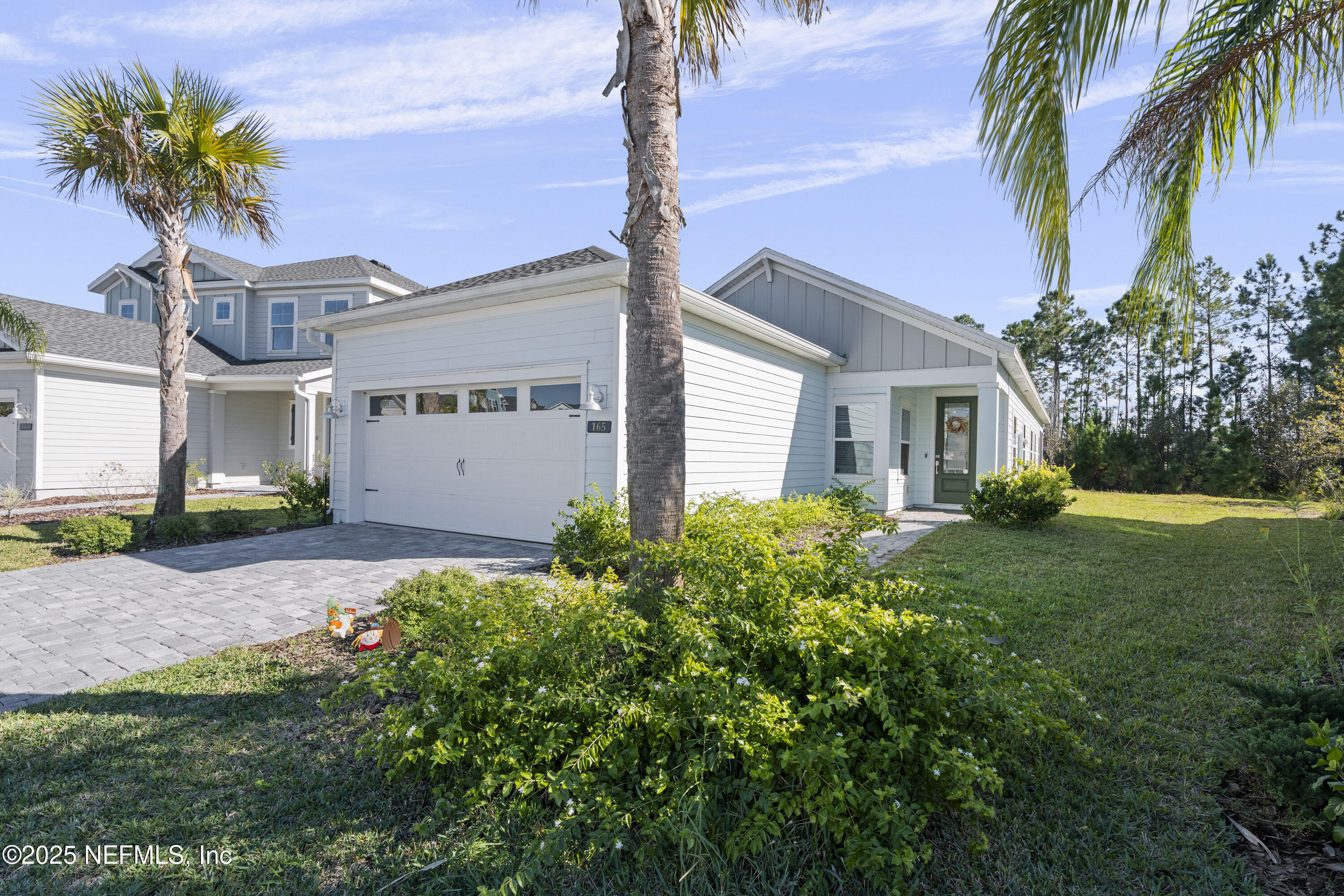 165 Killarney Avenue St. Johns, FL 32259 - Photo 1 of 63 a front view of a house with garden