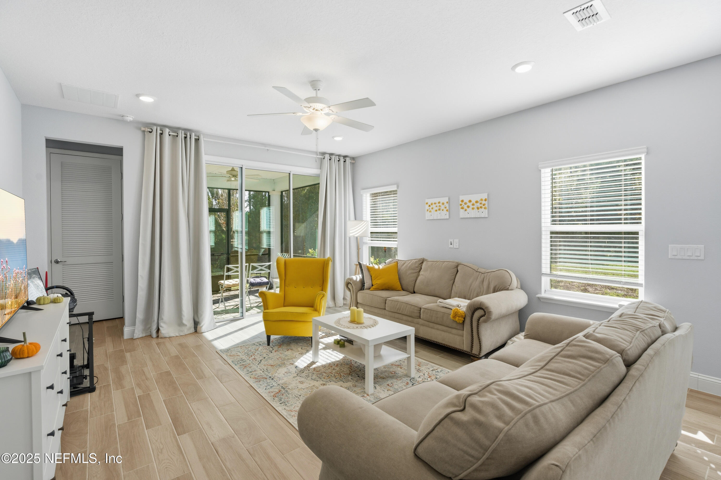 165 Killarney Avenue St. Johns, FL 32259 - Photo 12 of 63 a living room with furniture and a large window