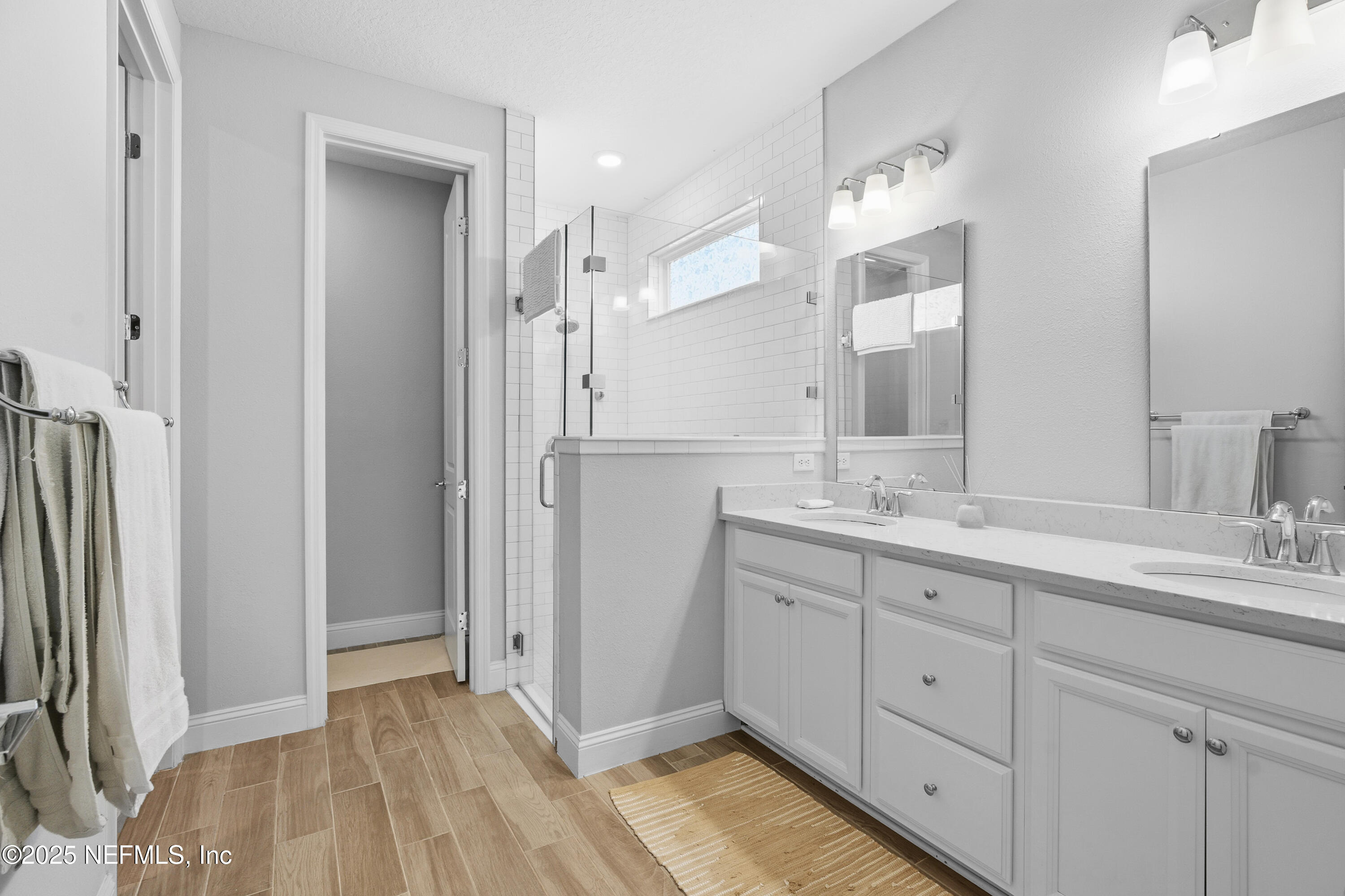 165 Killarney Avenue St. Johns, FL 32259 - Photo 18 of 63 a bathroom with a double vanity sink mirror and double