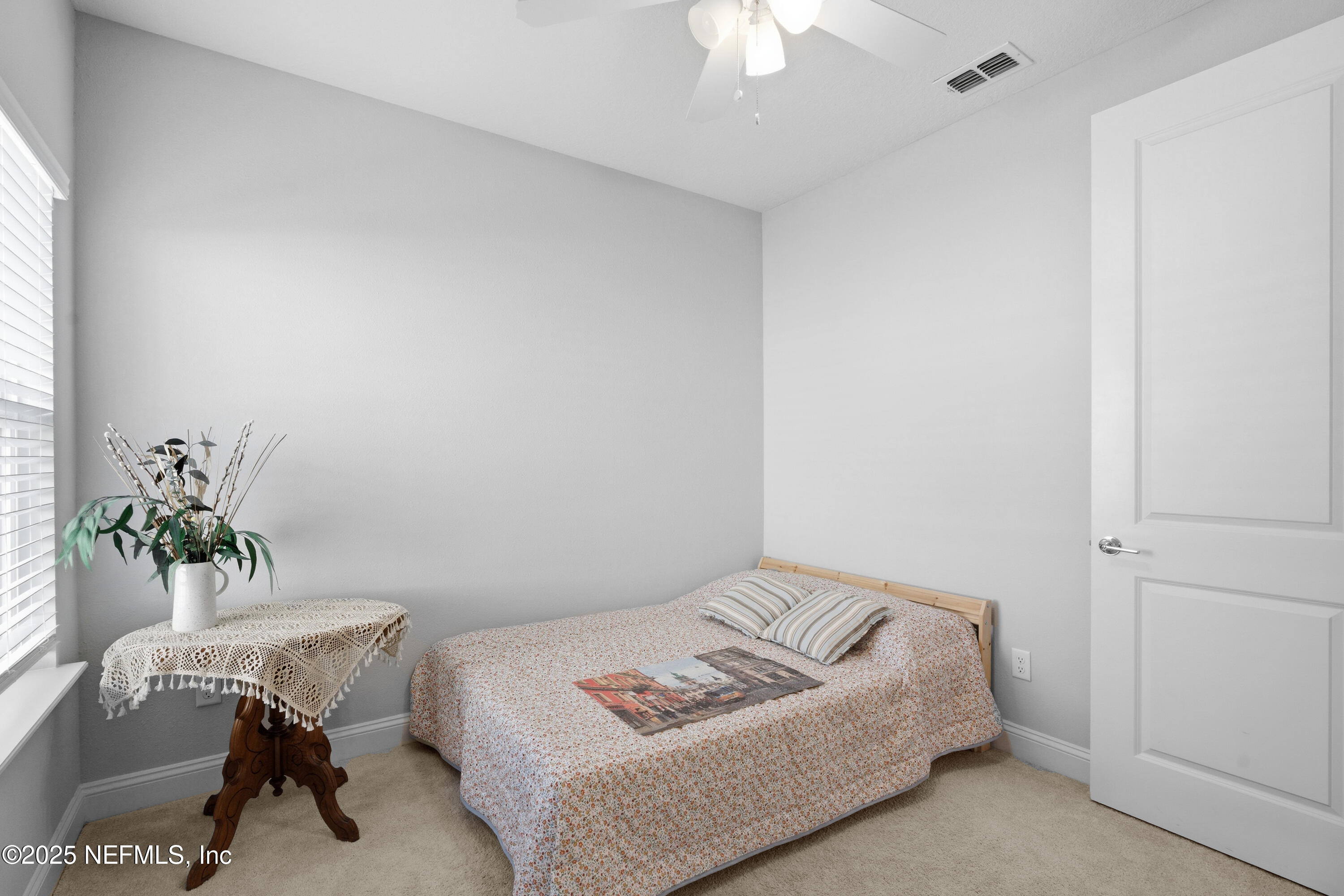 165 Killarney Avenue St. Johns, FL 32259 - Photo 21 of 63 a bedroom with a bed and a table