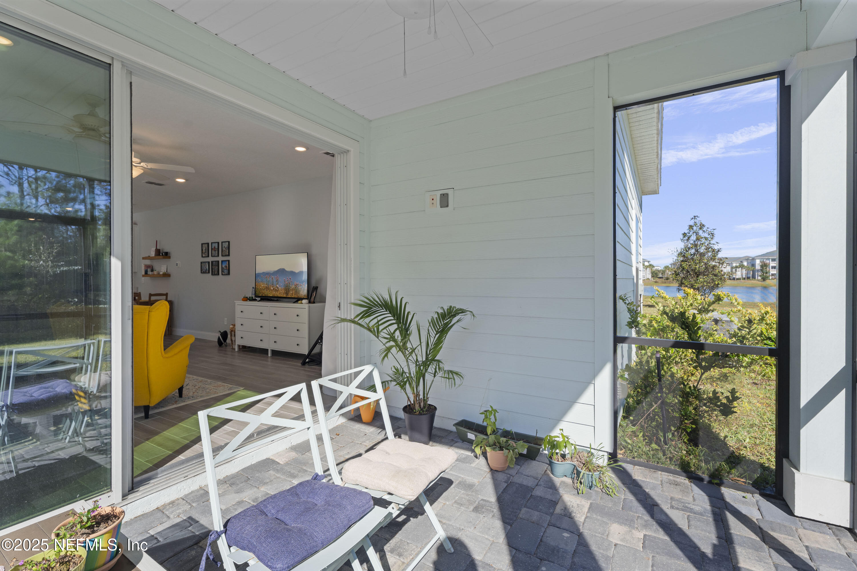 165 Killarney Avenue St. Johns, FL 32259 - Photo 30 of 63 a dining room with furniture and a floor to ceiling window