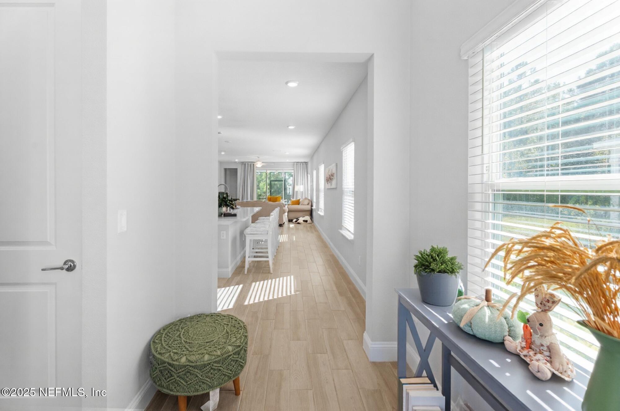 165 Killarney Avenue St. Johns, FL 32259 - Photo 5 of 63 a view of a livingroom with furniture wooden floor and a chandelier