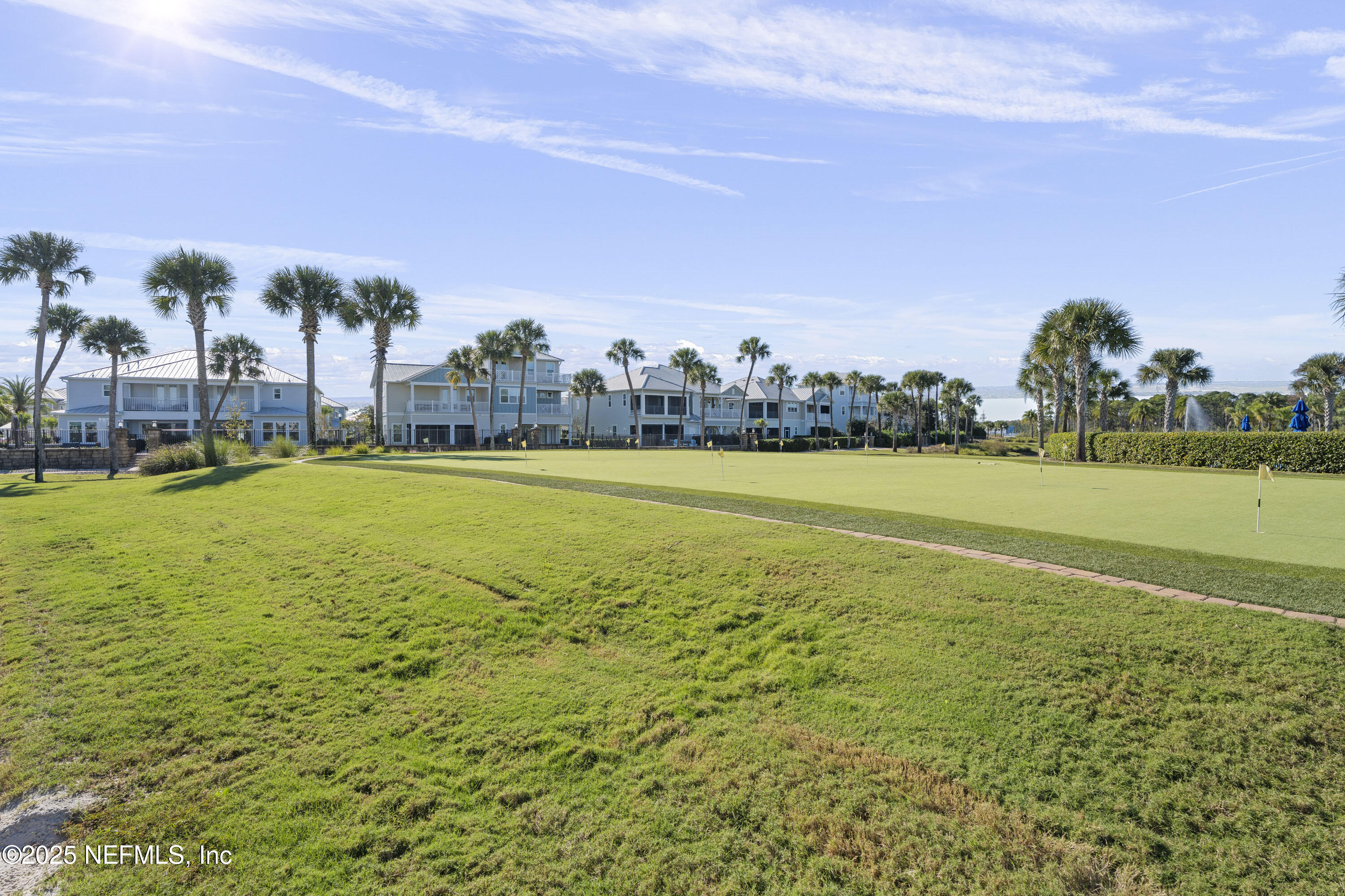 165 Killarney Avenue St. Johns, FL 32259 - Photo 62 of 63 a view of a large pool with lawn chairs and large trees
