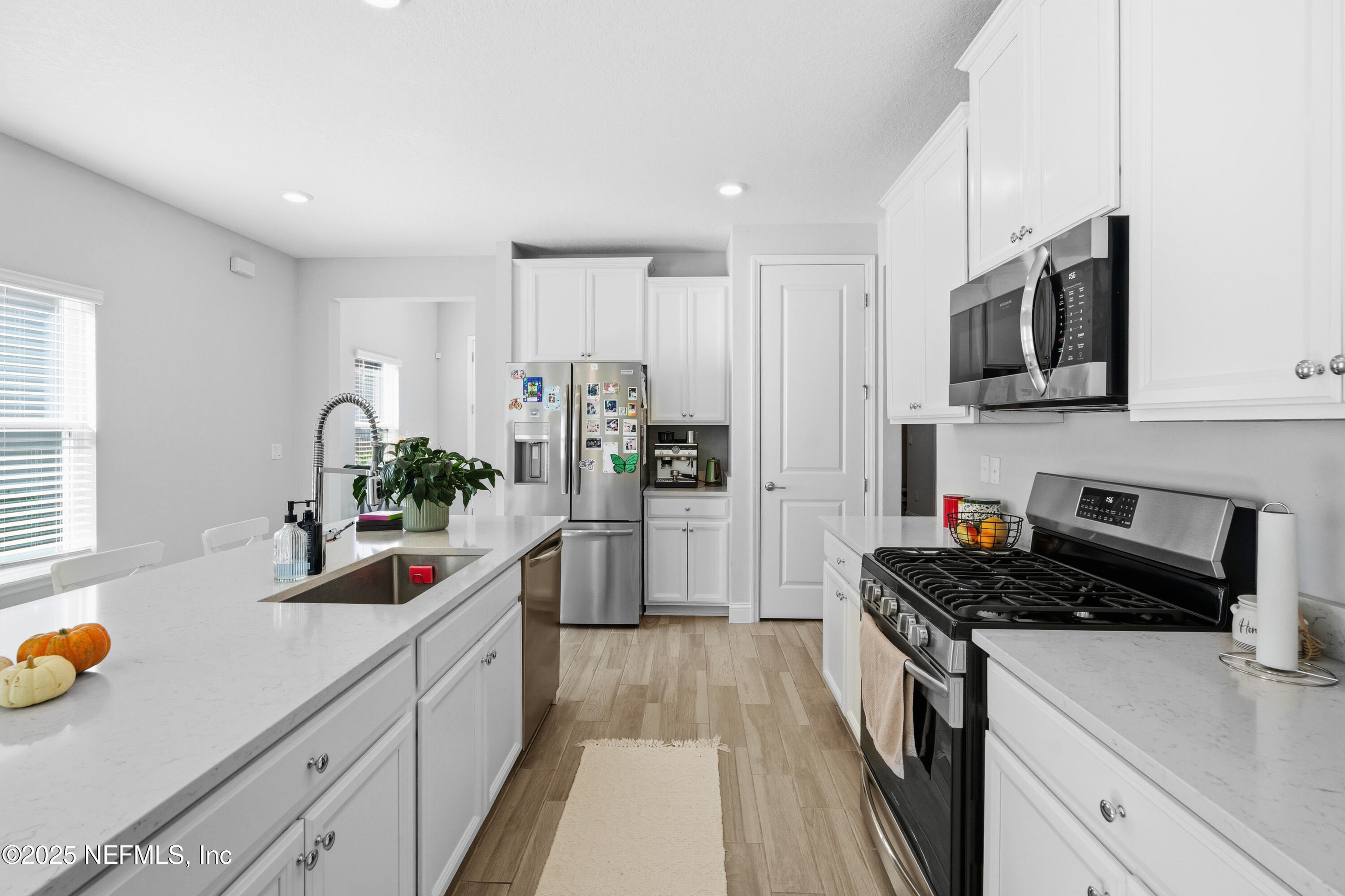 165 Killarney Avenue St. Johns, FL 32259 - Photo 10 of 63 a kitchen with stainless steel appliances a sink a stove and cabinets