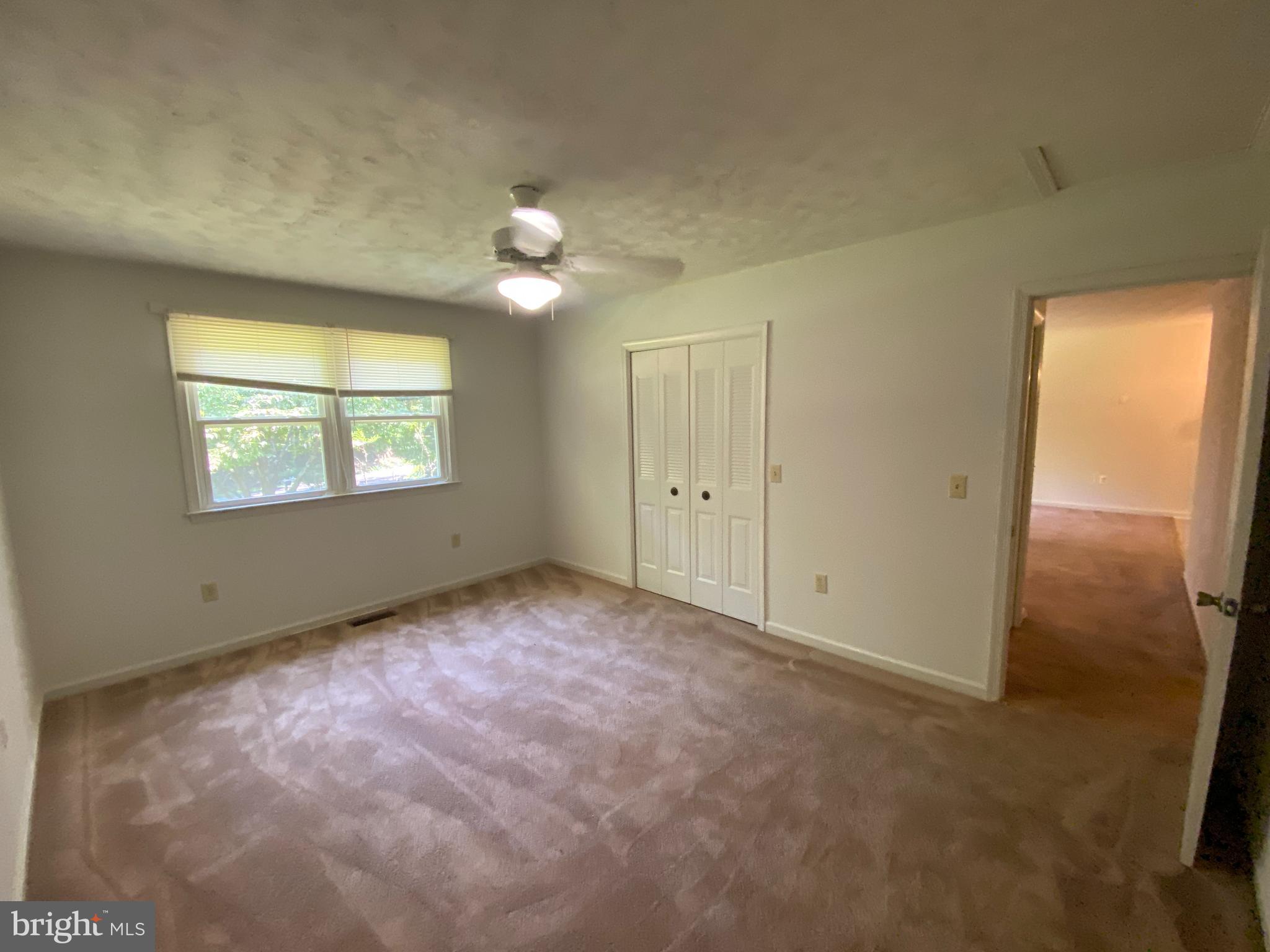 8444 Indiantown Road King George, VA 22485 - Photo 15 of 22 an empty room with windows and fan