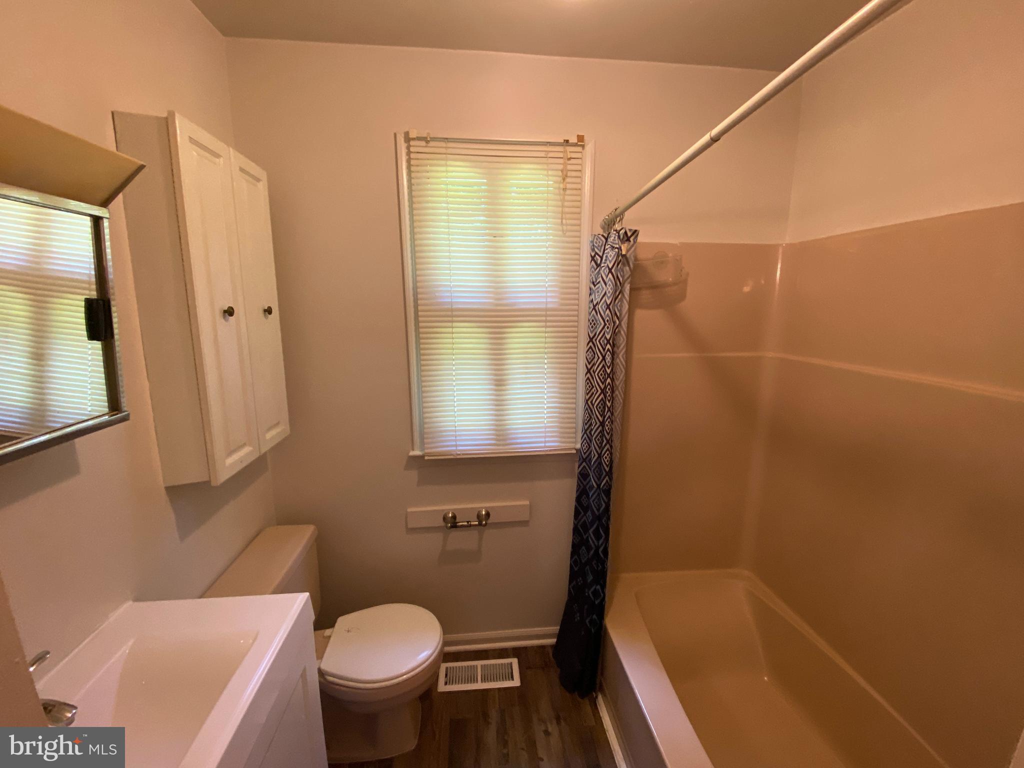 8444 Indiantown Road King George, VA 22485 - Photo 20 of 22 a bathroom with a granite countertop bathtub shower sink vanity and a toilet