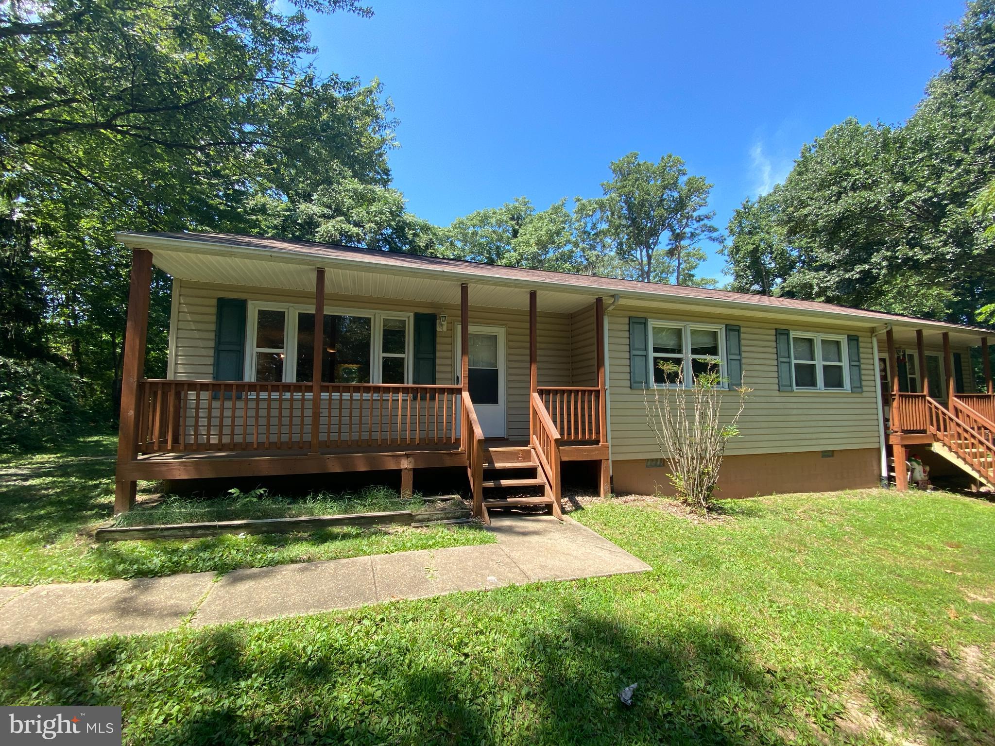8444 Indiantown Road King George, VA 22485 - Photo 2 of 22 a view of a house with a yard and a large tree front of house