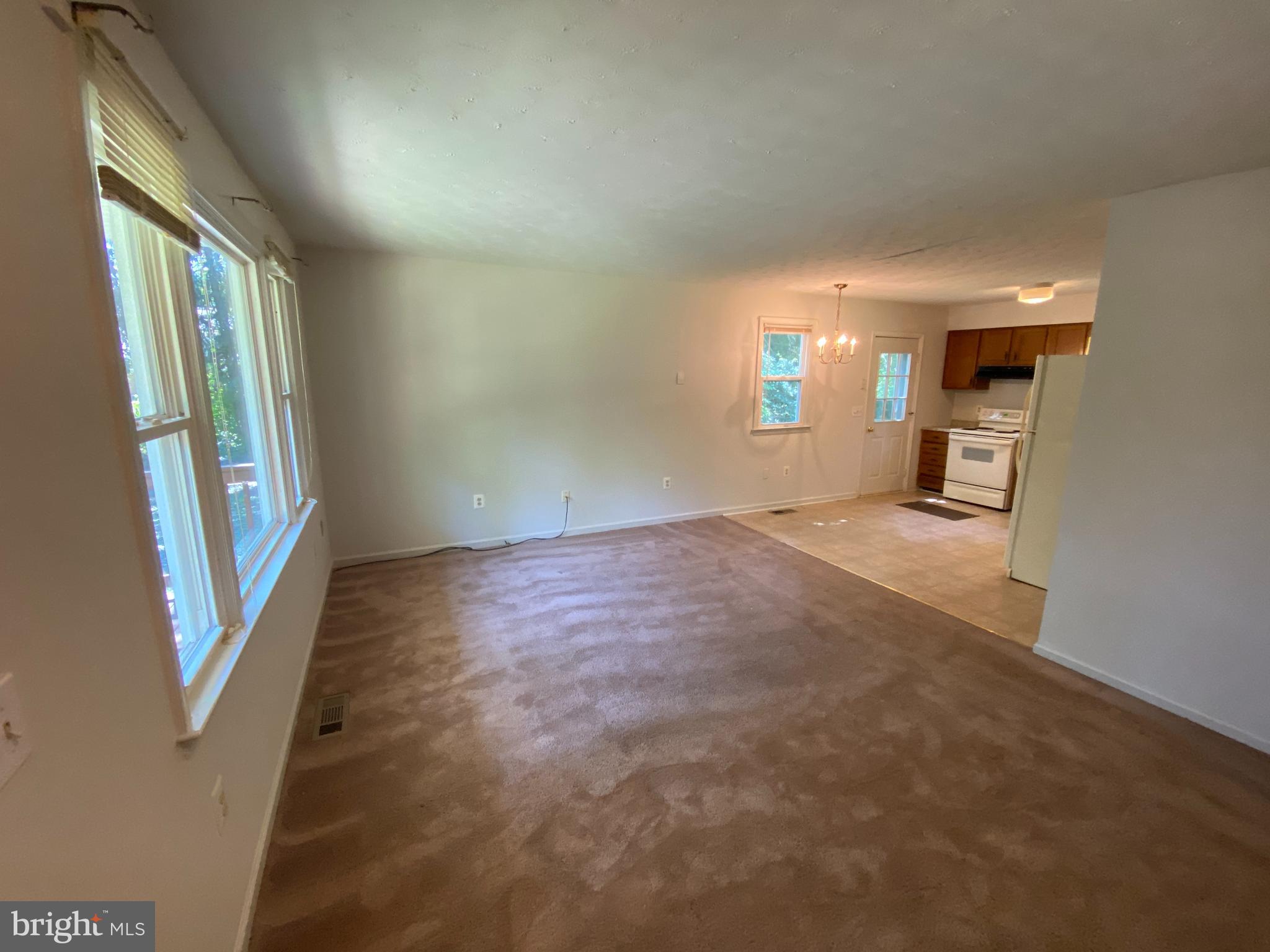 8444 Indiantown Road King George, VA 22485 - Photo 3 of 22 a view of a room with a large window and fire place