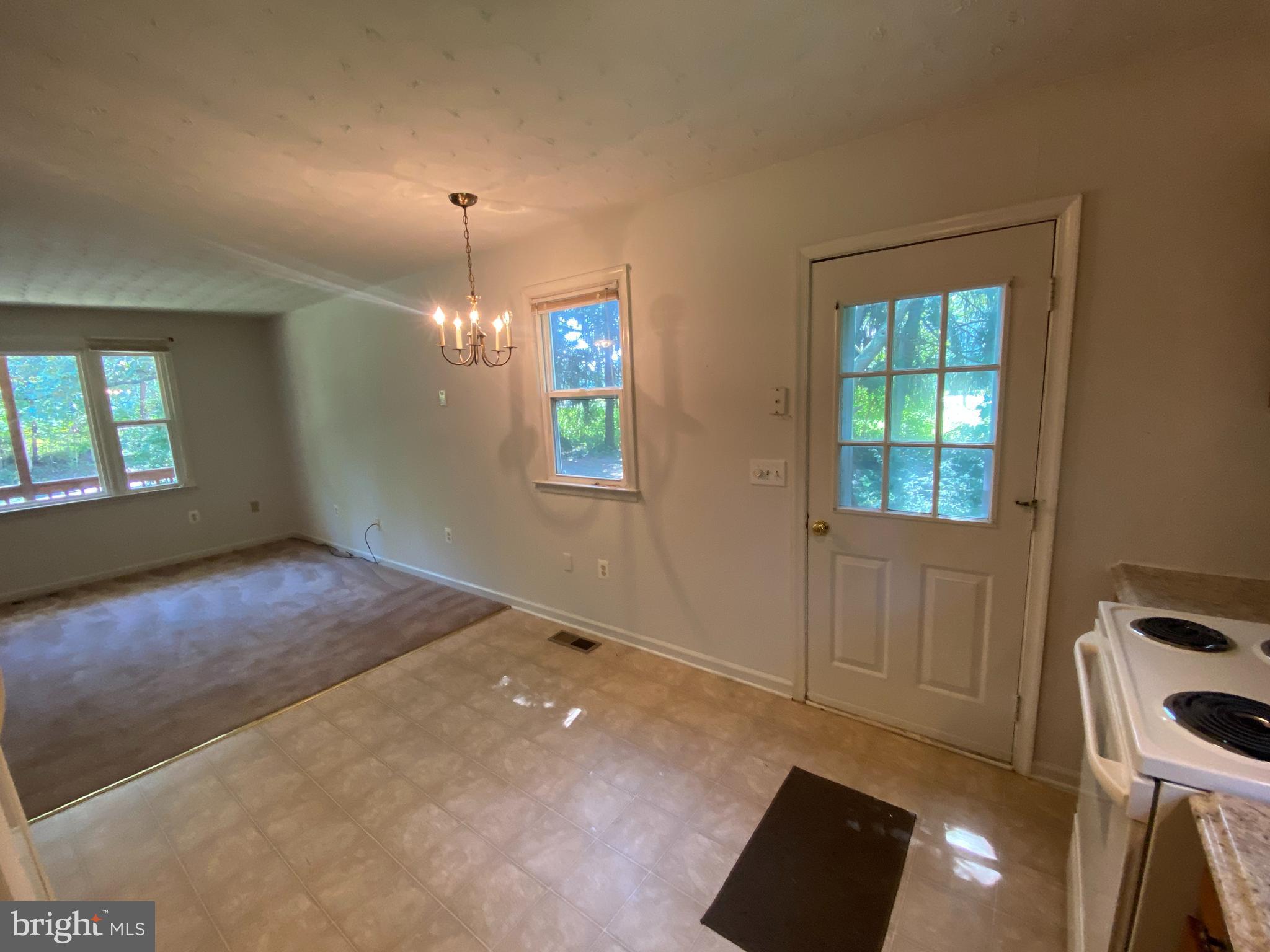 8444 Indiantown Road King George, VA 22485 - Photo 8 of 22 an empty room with windows and fireplace