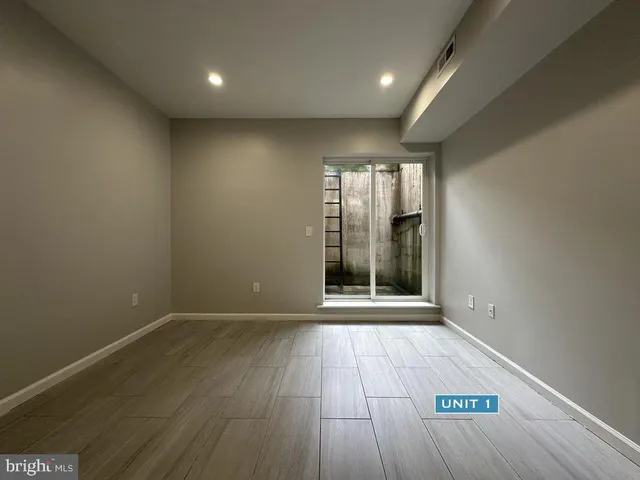 a kitchen with a sink and steel appliances