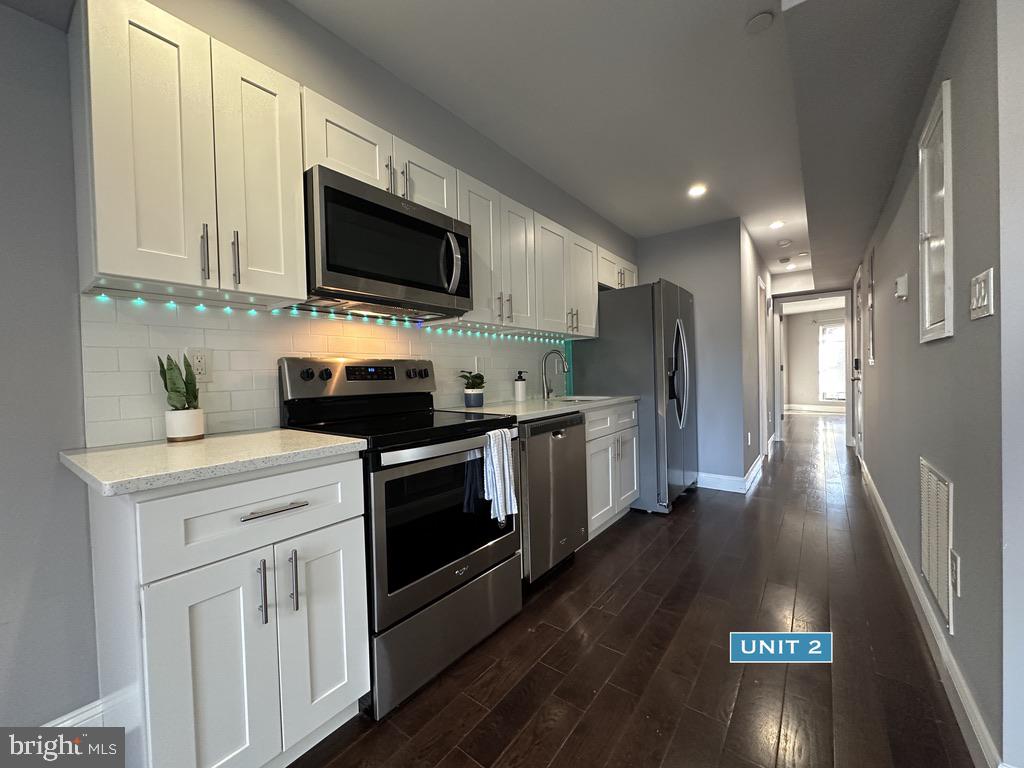 1606 Point Breeze Avenue Philadelphia, PA 19145 - Photo 16 of 35 a kitchen with a sink and steel appliances