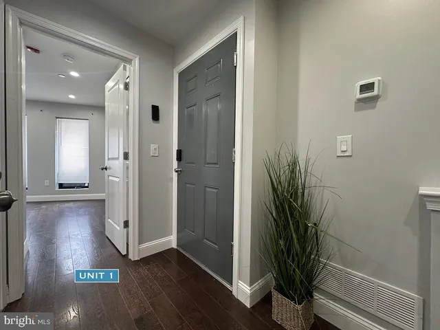 a view of room with hardwood floor