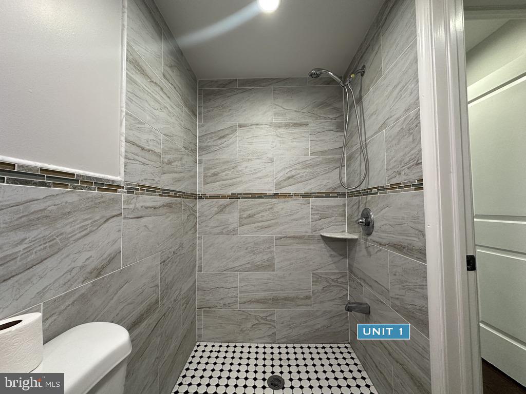 1606 Point Breeze Avenue Philadelphia, PA 19145 - Photo 10 of 35 a bathroom with a sink and a toilet