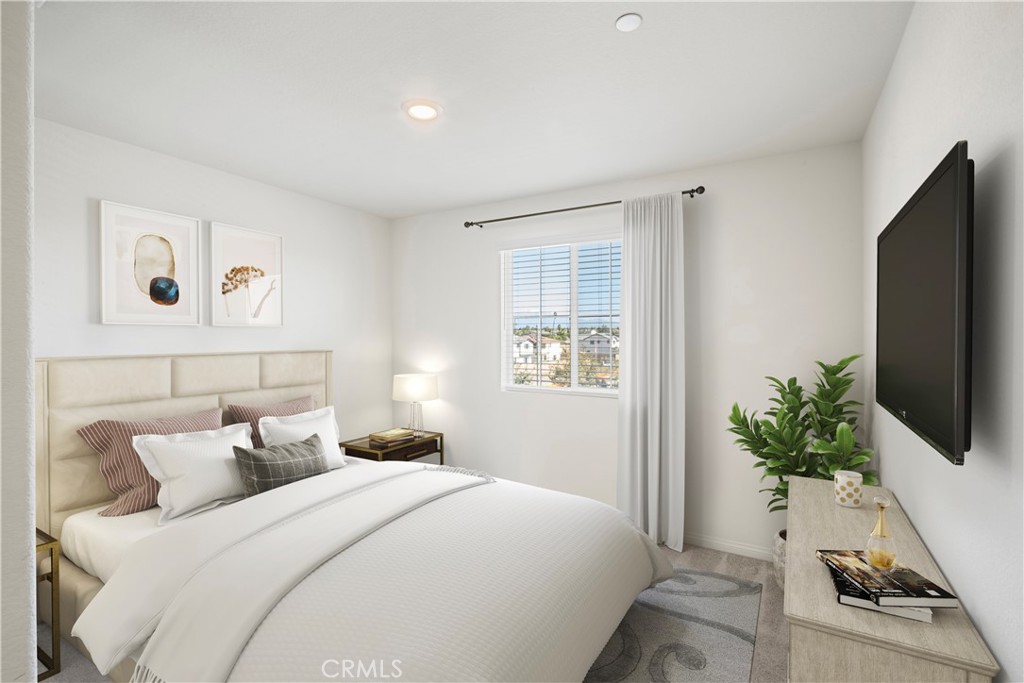 9605 Bonsai Lane Riverside, CA 92508 - Photo 13 of 30 a bedroom with a bed and a flat screen tv