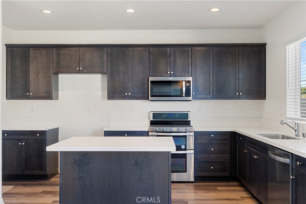 9605 Bonsai Lane Riverside, CA 92508 - Photo 15 of 30 a kitchen with a cabinets and steel stainless steel appliances