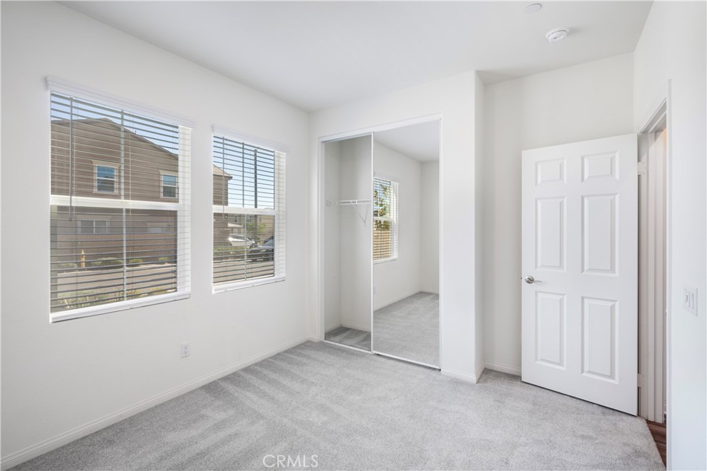 9605 Bonsai Lane Riverside, CA 92508 - Photo 17 of 30 an empty room with windows