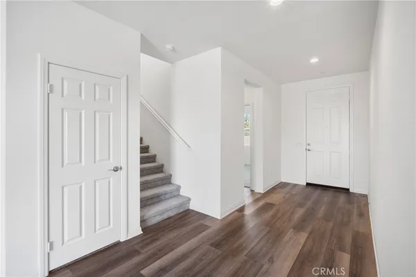 a view of entryway with wooden floor