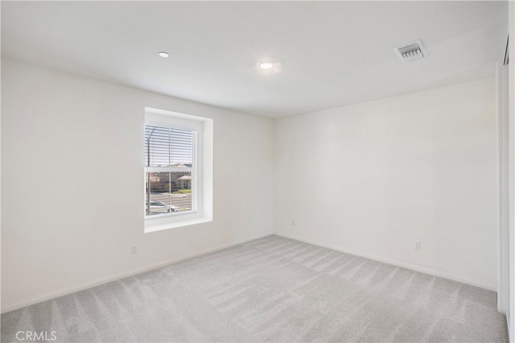 9605 Bonsai Lane Riverside, CA 92508 - Photo 25 of 30 an empty room with windows
