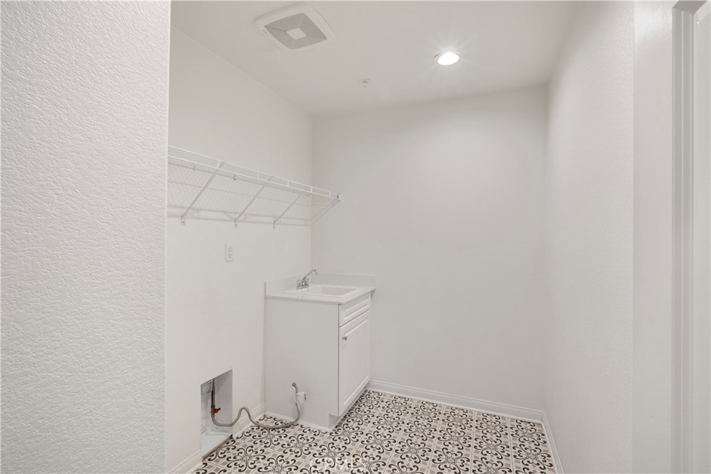 9605 Bonsai Lane Riverside, CA 92508 - Photo 28 of 30 a bathroom with a sink