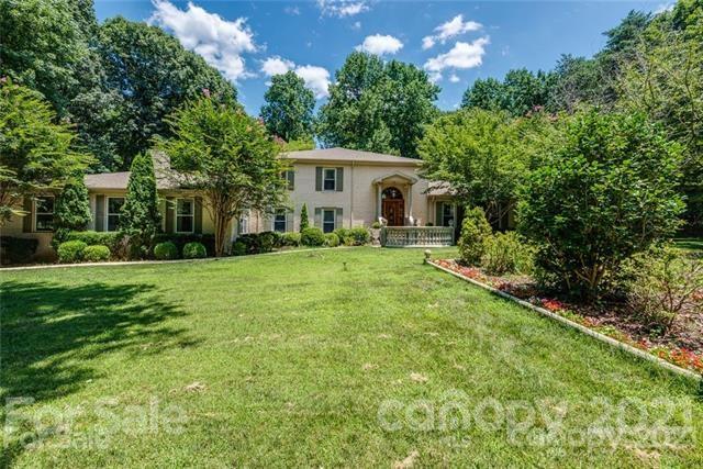 2932 High Ridge Road Charlotte, NC 28270 - Photo 1 of 26 a view of a house with a yard