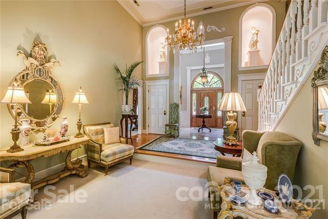 2932 High Ridge Road Charlotte, NC 28270 - Photo 11 of 26 a living room with patio furniture and a chandelier