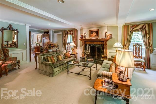 2932 High Ridge Road Charlotte, NC 28270 - Photo 12 of 26 a living room with furniture a fireplace and large windows