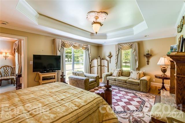 2932 High Ridge Road Charlotte, NC 28270 - Photo 14 of 26 a bedroom with furniture and a flat screen tv