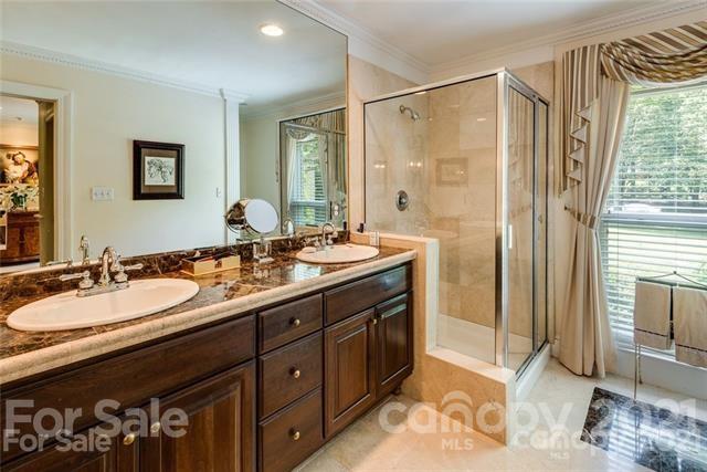 2932 High Ridge Road Charlotte, NC 28270 - Photo 15 of 26 a bathroom with a double vanity sink and a mirror