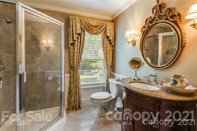 2932 High Ridge Road Charlotte, NC 28270 - Photo 18 of 26 a bathroom with a sink a toilet and a mirror