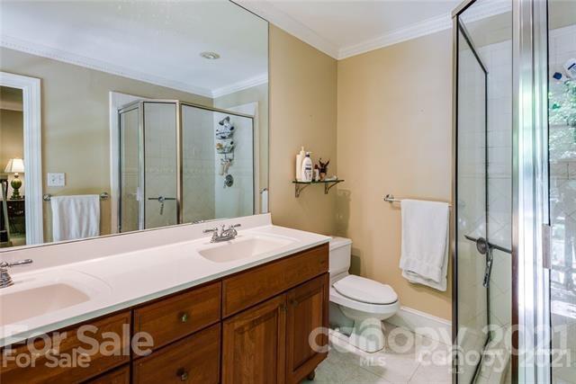 2932 High Ridge Road Charlotte, NC 28270 - Photo 20 of 26 a bathroom with a sink a toilet and shower